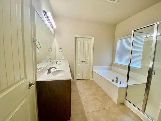 bathroom featuring vanity, separate shower and tub, and tile patterned flooring