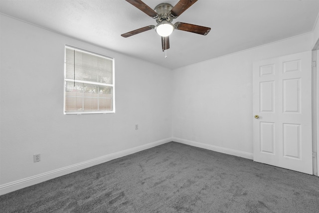 carpeted empty room featuring ceiling fan