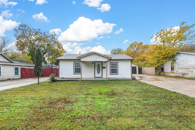 view of front of home with a porch and a front lawn