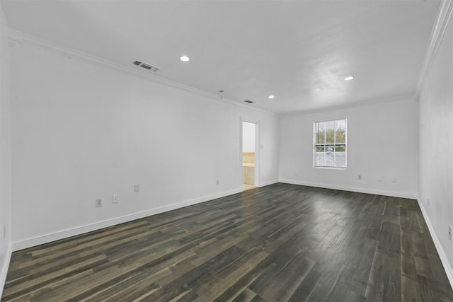 empty room with crown molding and dark hardwood / wood-style floors