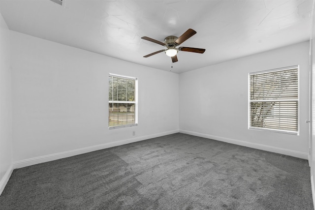 carpeted empty room featuring ceiling fan