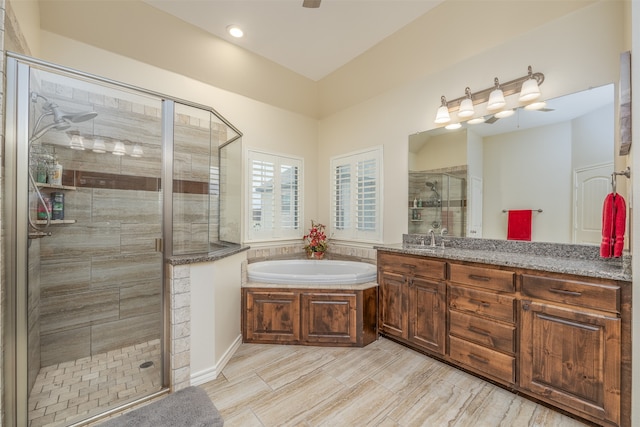 bathroom with separate shower and tub, hardwood / wood-style flooring, and vanity