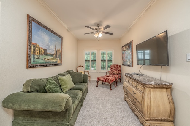 carpeted living room with ceiling fan and ornamental molding