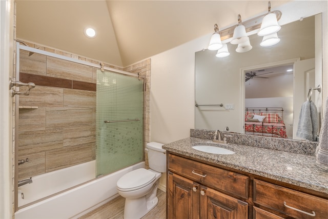 full bathroom with toilet, vanity, wood-type flooring, bath / shower combo with glass door, and vaulted ceiling