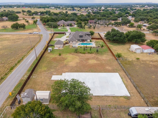 birds eye view of property with a rural view