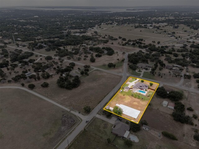 birds eye view of property with a rural view