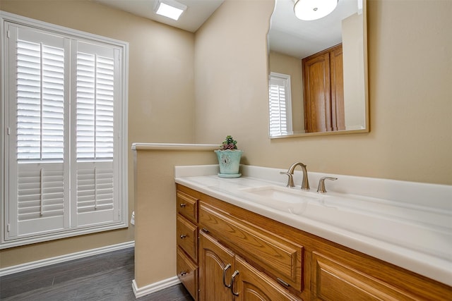 bathroom featuring vanity and hardwood / wood-style flooring