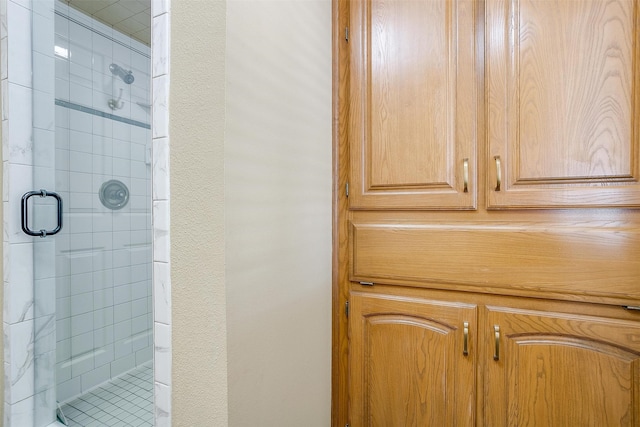 bathroom with a shower with shower door