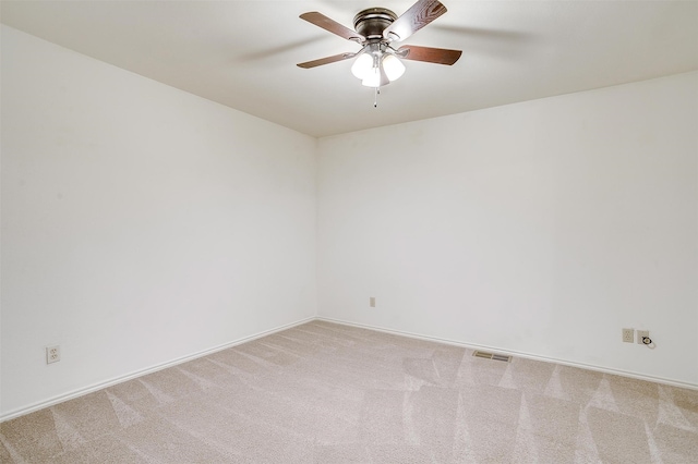 unfurnished room featuring light carpet and ceiling fan