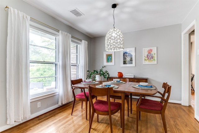 dining space featuring light wood-type flooring