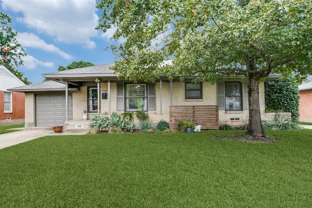 view of front facade with a front lawn, covered porch, and a garage