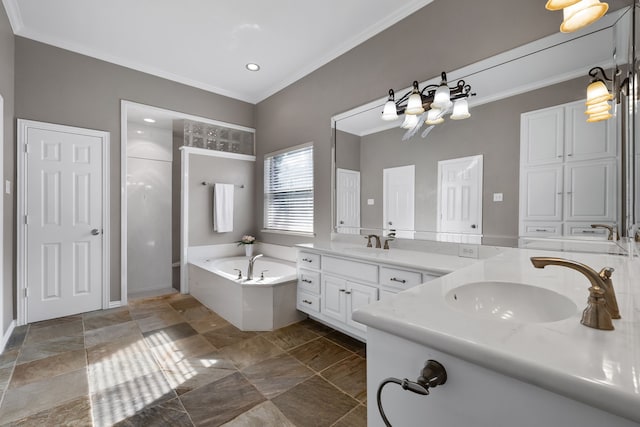 bathroom with crown molding, vanity, and a bathtub