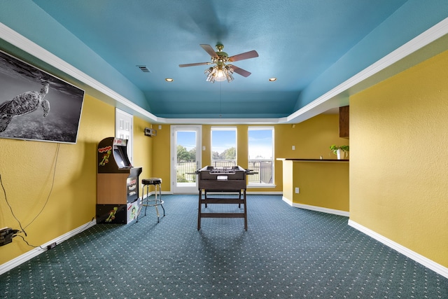 interior space with lofted ceiling, carpet, and ceiling fan