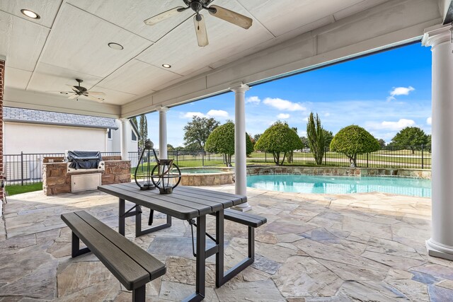 view of patio with a fenced in pool and ceiling fan