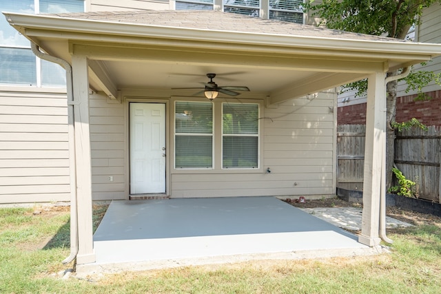 doorway to property featuring ceiling fan and a patio area