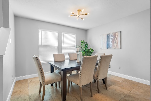 dining space featuring an inviting chandelier