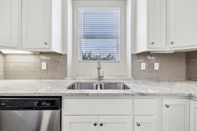 kitchen with sink, stainless steel dishwasher, and white cabinets