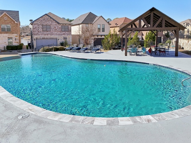 view of swimming pool featuring a gazebo and a patio area