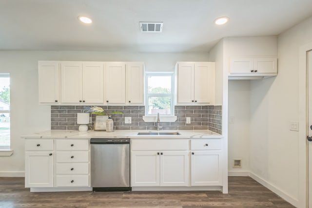 kitchen featuring dishwasher, sink, dark hardwood / wood-style floors, and white cabinets