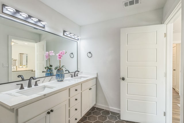 bathroom featuring vanity and hardwood / wood-style floors