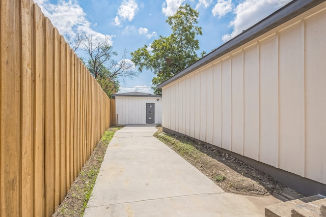 exterior space featuring a shed and a patio