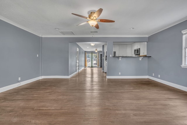 unfurnished living room featuring a textured ceiling, crown molding, ceiling fan, and hardwood / wood-style floors