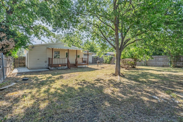 view of yard featuring a wooden deck