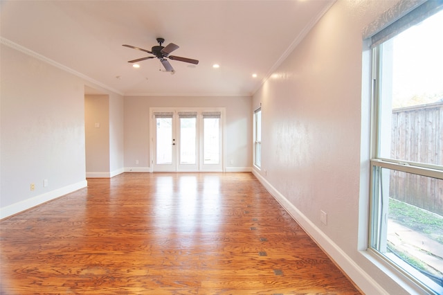 unfurnished room with crown molding, hardwood / wood-style flooring, and ceiling fan