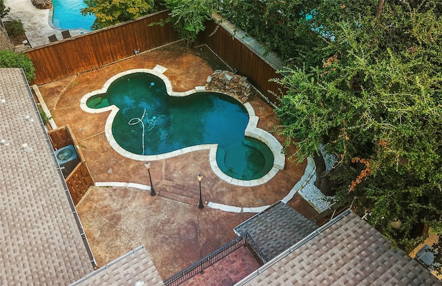 view of pool with a jacuzzi and a patio area