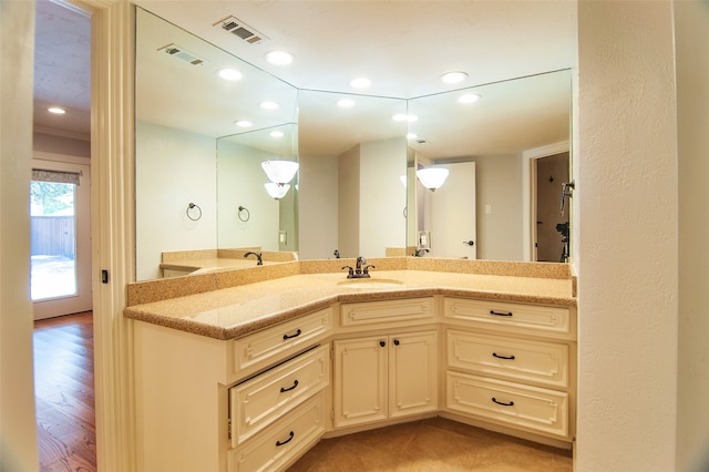 bathroom with wood-type flooring and vanity