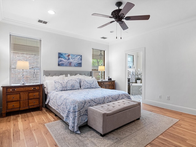 bedroom with light wood-type flooring, connected bathroom, ceiling fan, and crown molding