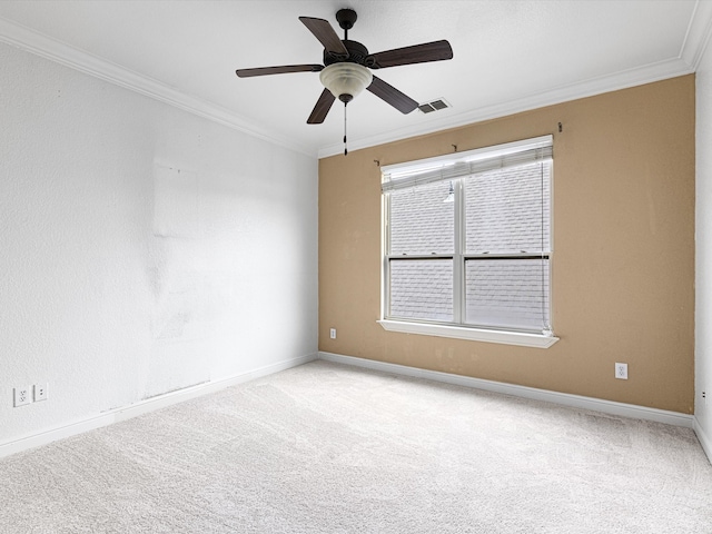 unfurnished room featuring ceiling fan, light colored carpet, and ornamental molding