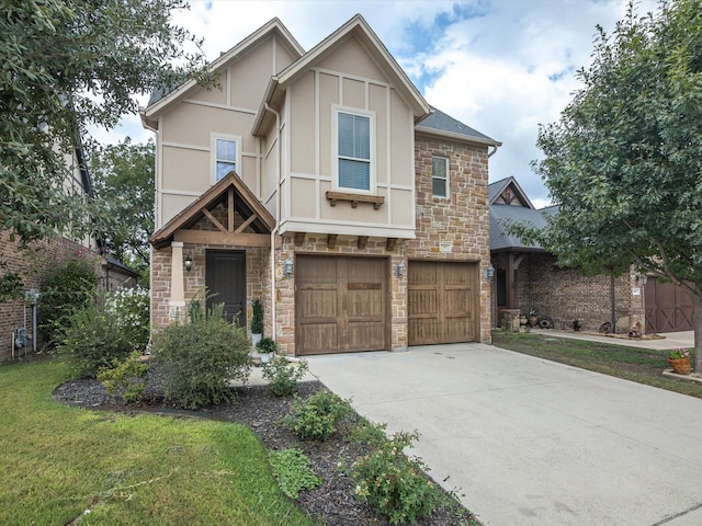 tudor home featuring a garage