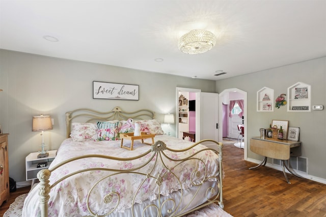 bedroom featuring dark wood-type flooring