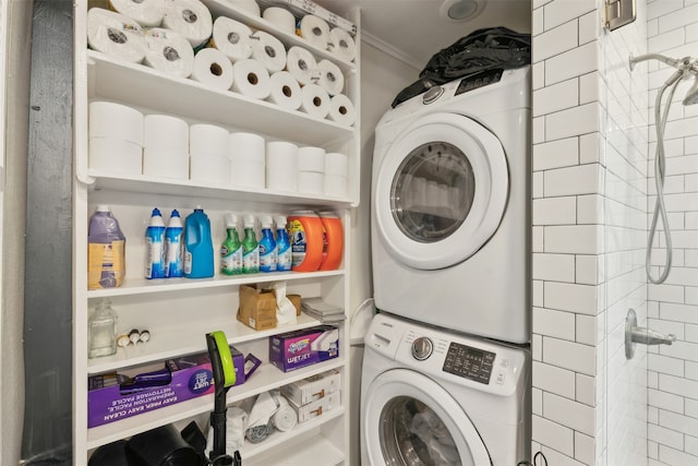 laundry area featuring stacked washer and dryer