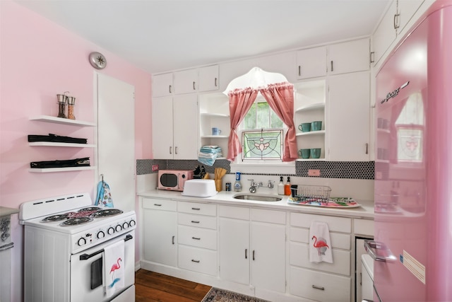 kitchen featuring white cabinetry, white appliances, sink, and dark hardwood / wood-style floors