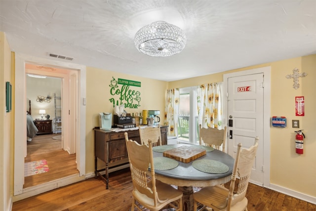 dining room featuring dark hardwood / wood-style floors