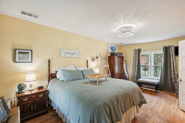 bedroom featuring dark hardwood / wood-style flooring