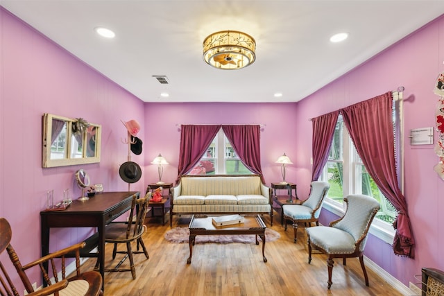 living area with hardwood / wood-style flooring