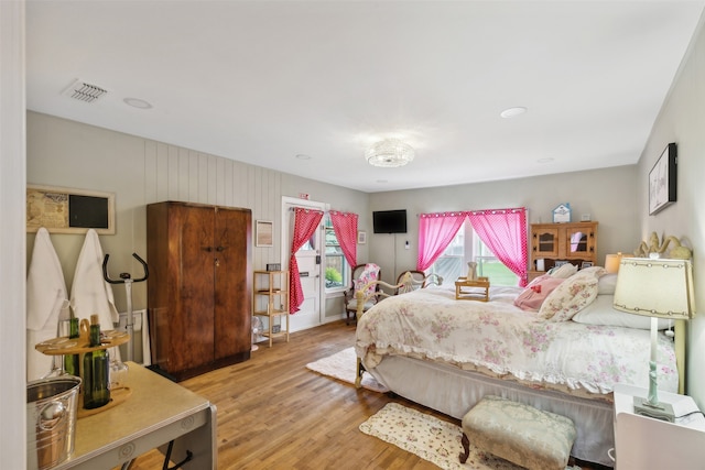 bedroom with hardwood / wood-style flooring