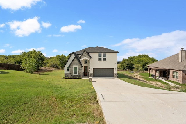 view of front of property with a garage and a front yard