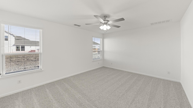 carpeted empty room with ceiling fan