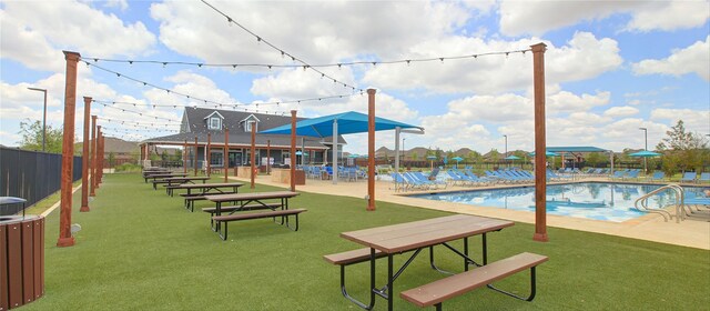 view of community with a swimming pool, a lawn, a patio area, and a gazebo