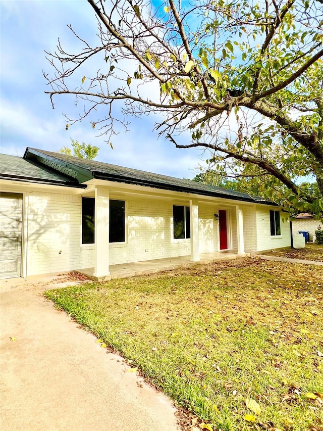 view of home's exterior with a lawn