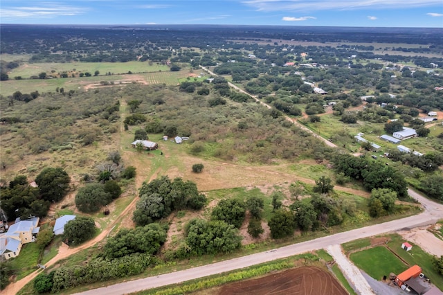 birds eye view of property featuring a rural view