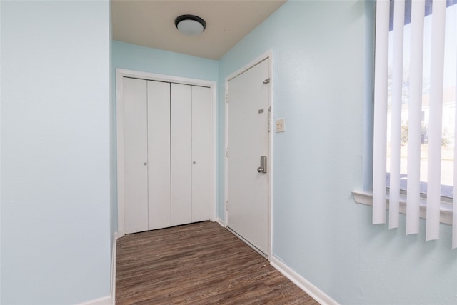 hallway with dark wood-type flooring