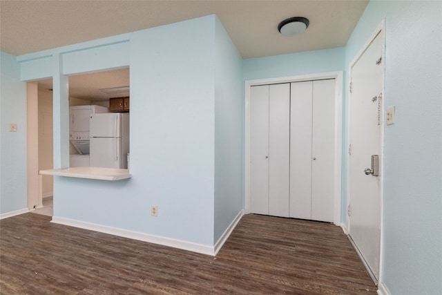 foyer entrance featuring dark wood-type flooring