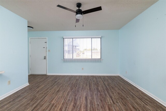 104 Harbor Dr Unit 111, Runaway Bay, TX 76426 - unfurnished room with dark wood-style flooring, ceiling fan, and baseboards