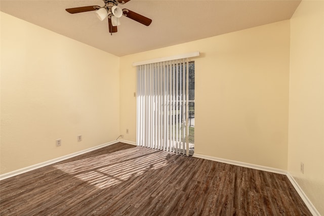 empty room featuring ceiling fan and dark hardwood / wood-style flooring