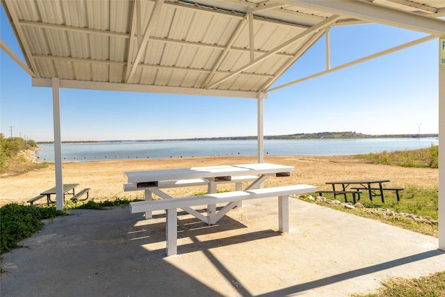 view of patio with a water view